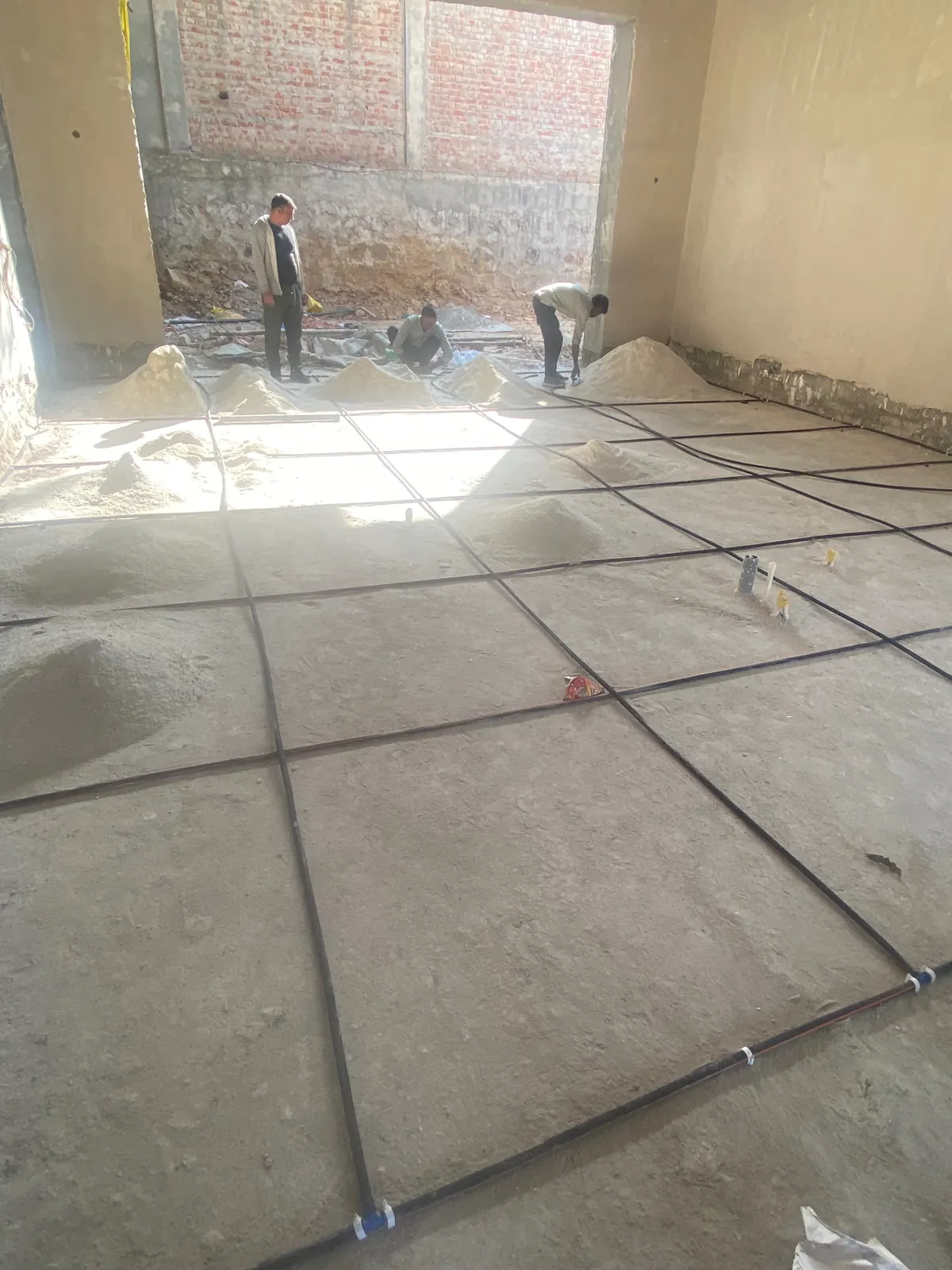 PCES termite piping network laid across a floor before tiling