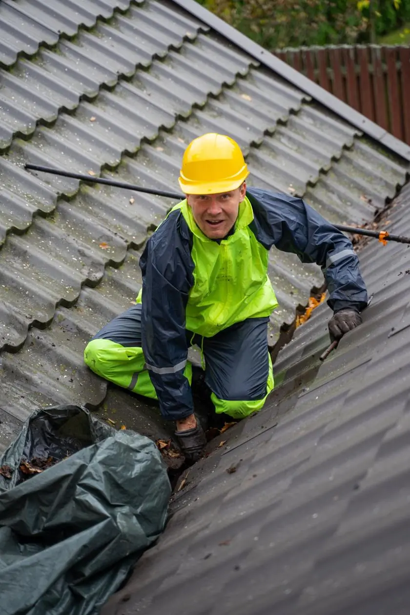 Applicator working on a building roof